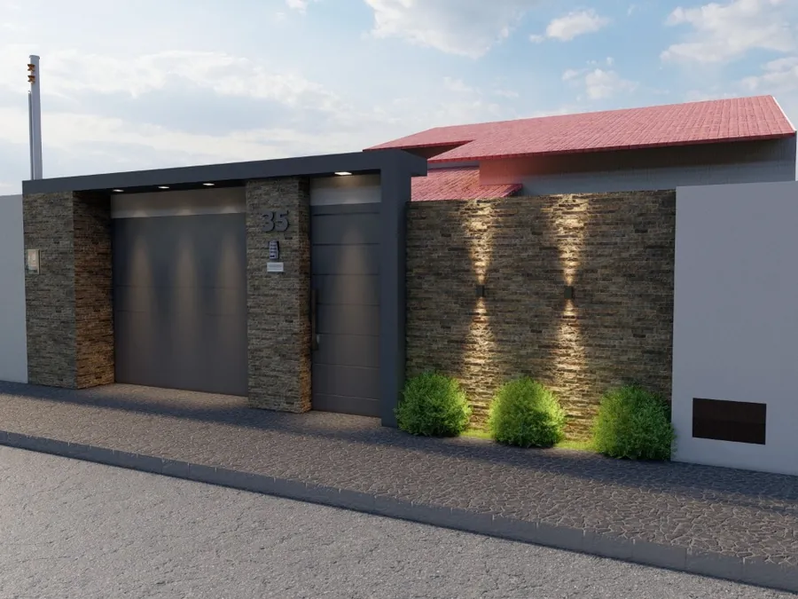 Casa térrea com revestimento em pedra e iluminação de fachada